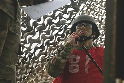 Staff Sgt. Anthony Miller, a rifle squad leader with the Illinois Army National Guard’s C Company, 2nd Battalion, 130th Infantry Regiment, listens to instruction during a voice communications exercise. In this timed-exercise, Miller was required to report a current situation to a higher command with 100 percent accuracy.